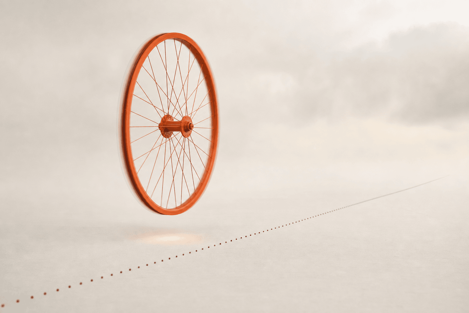 A burnt-orange spoked wheel spinning in mid-air beside a dotted road line it never touches, a soft glow where its shadow should land: flat out, and going nowhere.