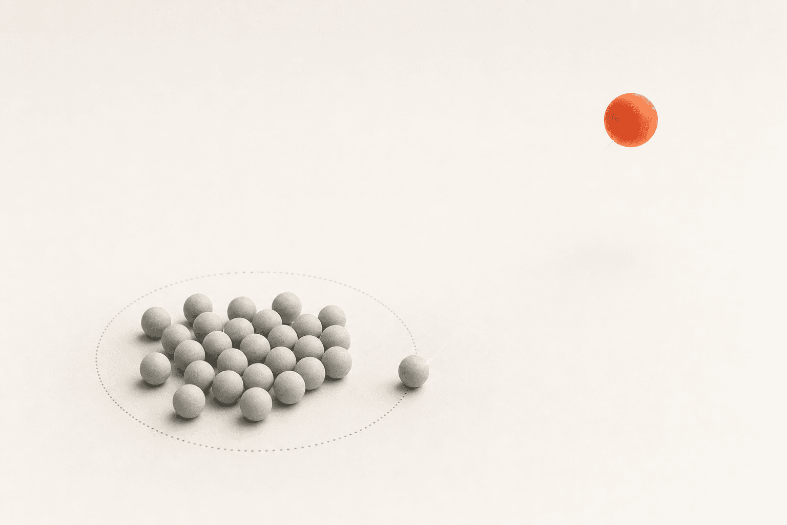 A cluster of pale grey spheres gathered inside a faint dotted ring, one stray sphere just beyond its edge, and a single burnt-orange sphere hovering far out in the empty white: search catches the demand already inside the line, while creating demand reaches past it.