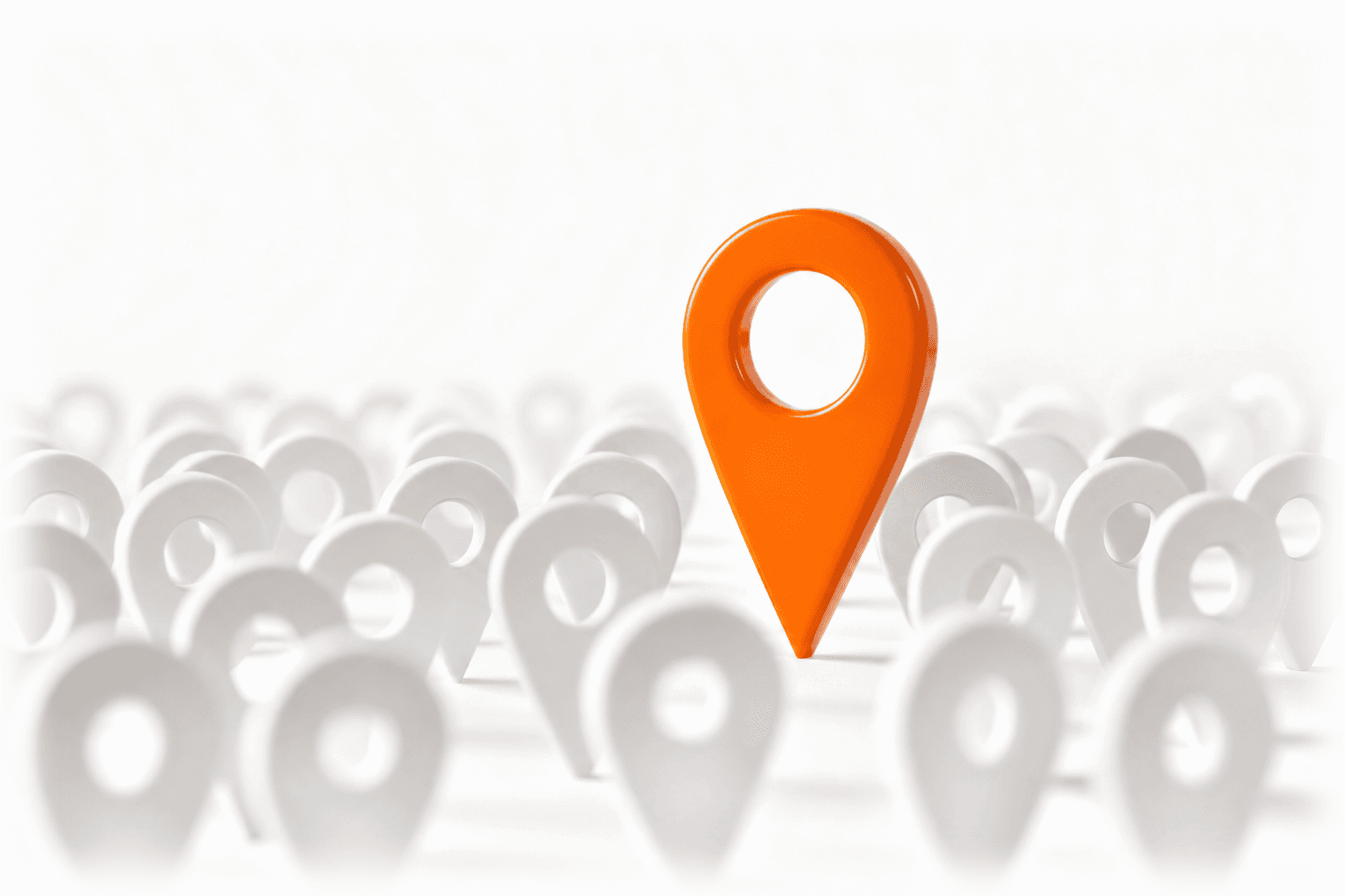One bright orange map pin standing tall above a crowd of plain white pins: the business chosen among many.