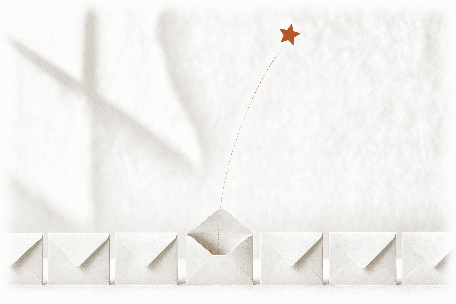 A row of identical pale envelopes stands sealed in soft daylight, one of them open, and a single small burnt-orange star rises out of it along a fine dotted arc: the one finished job whose private thank-you was turned into public proof.