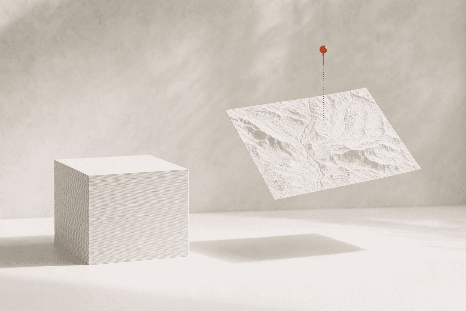 A tall stack of identical blank pale pages beside one levitating page embossed with the contours of a real place, held by a small burnt-orange map pin: thirty copies of the same page, and the one that could only belong here.